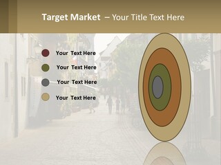 A Group Of People Walking Down A Street Next To Tall Buildings PowerPoint Template