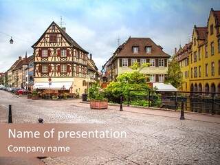 A City Street With Old Buildings And Cobblestones PowerPoint Template