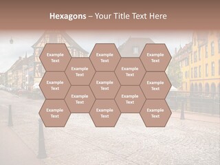 A City Street With Old Buildings And Cobblestones PowerPoint Template
