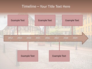 A City Street With Old Buildings And Cobblestones PowerPoint Template