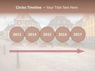 A City Street With Old Buildings And Cobblestones PowerPoint Template