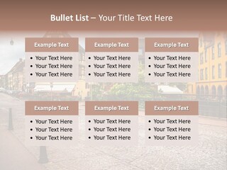 A City Street With Old Buildings And Cobblestones PowerPoint Template