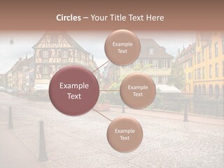 A City Street With Old Buildings And Cobblestones PowerPoint Template