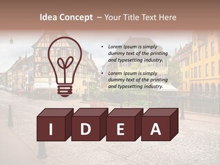 A City Street With Old Buildings And Cobblestones PowerPoint Template