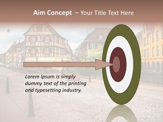 A City Street With Old Buildings And Cobblestones PowerPoint Template