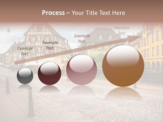 A City Street With Old Buildings And Cobblestones PowerPoint Template