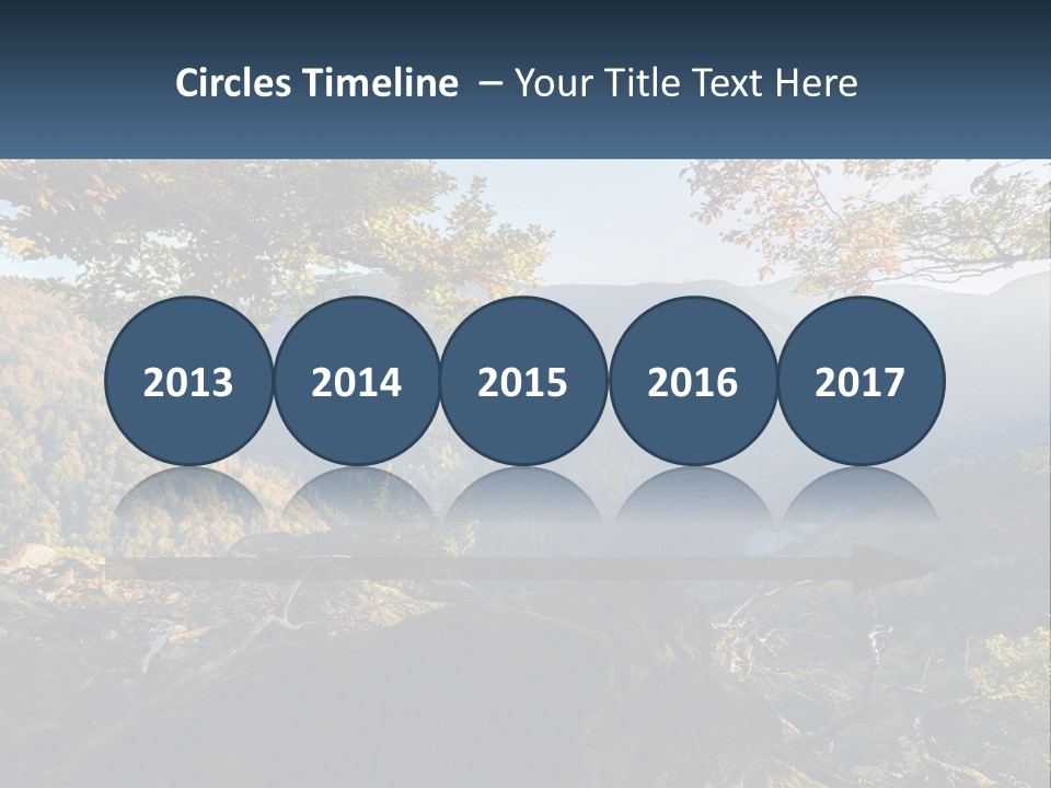 A Scenic View Of A Valley With Trees And Mountains In The Background PowerPoint Template