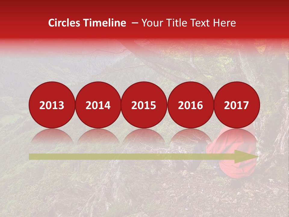 A Man Sitting On Top Of A Mountain Next To A Tree PowerPoint Template