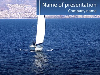 A Sailboat In A Body Of Water With A City In The Background PowerPoint Template