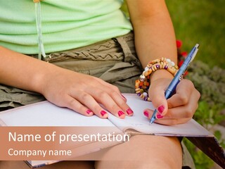 A Woman Writing On A Notebook With A Pen PowerPoint Template