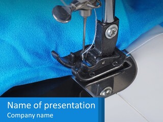 A Close Up Of A Sewing Machine With A Blue Cover PowerPoint Template