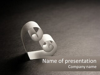 A White Paper Ring With The Letter B On It PowerPoint Template