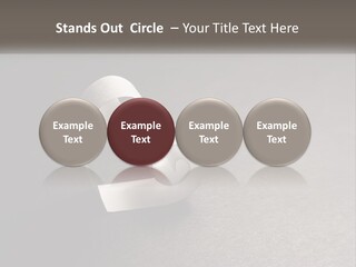 A White Paper Ring With The Letter B On It PowerPoint Template