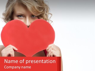 A Woman Holding A Red Heart In Front Of Her Face PowerPoint Template