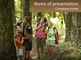 A Group Of Children Standing In The Woods PowerPoint Template