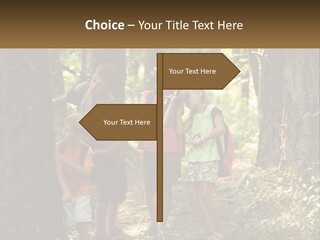 A Group Of Children Standing In The Woods PowerPoint Template