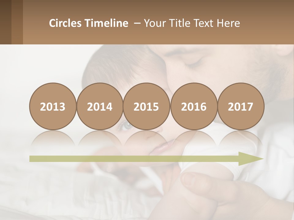 A Man Holding A Baby In His Arms PowerPoint Template