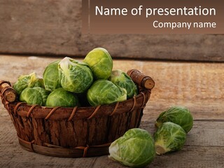 A Basket Of Brussel Sprouts On A Wooden Table PowerPoint Template