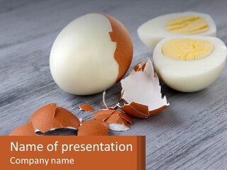 A Hard Boiled Egg On A Wooden Table PowerPoint Template