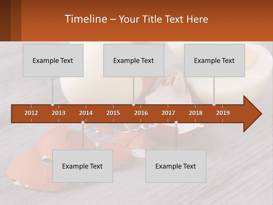 A Hard Boiled Egg On A Wooden Table PowerPoint Template