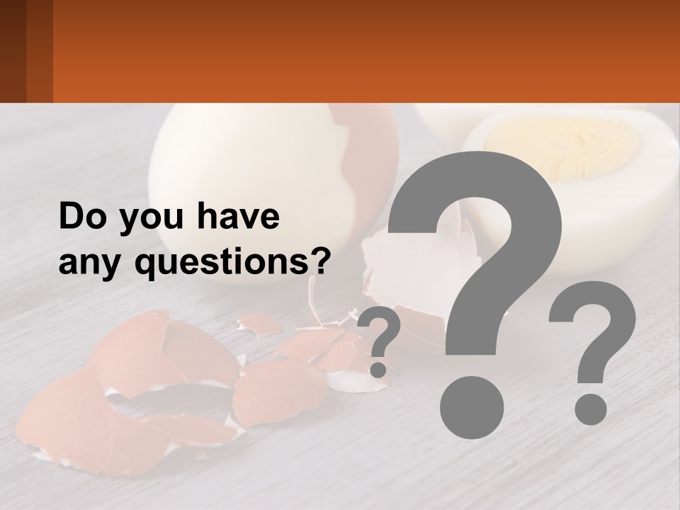 A Hard Boiled Egg On A Wooden Table PowerPoint Template