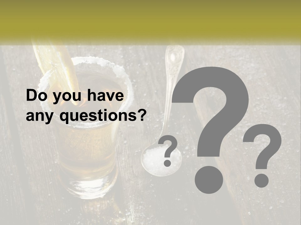 A Glass Of Ice Tea With A Spoon On A Wooden Table PowerPoint Template