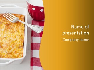 A Casserole Dish With A Fork On A Red And White Checkered Table PowerPoint Template