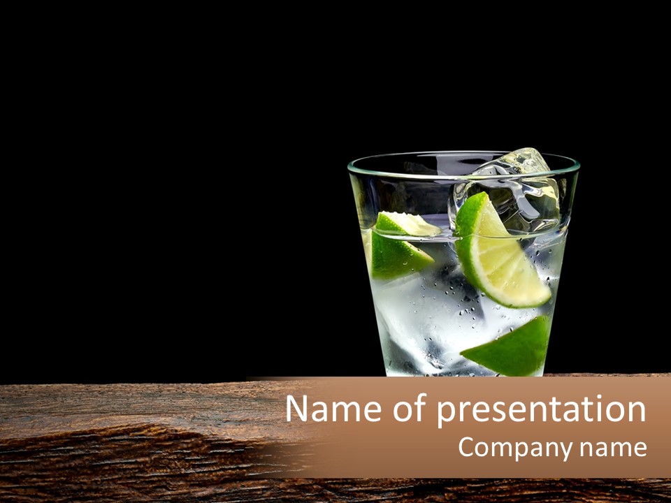 A Glass Of Water With Limes And Ice On A Wooden Table PowerPoint Template