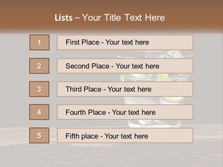 A Glass Of Water With Limes And Ice On A Wooden Table PowerPoint Template