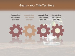 A Glass Of Water With Limes And Ice On A Wooden Table PowerPoint Template