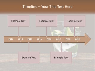 A Glass Of Water With Limes And Ice On A Wooden Table PowerPoint Template