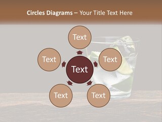 A Glass Of Water With Limes And Ice On A Wooden Table PowerPoint Template