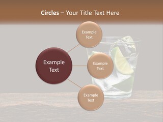 A Glass Of Water With Limes And Ice On A Wooden Table PowerPoint Template