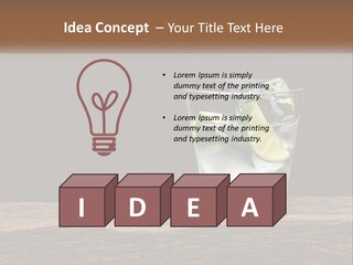 A Glass Of Water With Limes And Ice On A Wooden Table PowerPoint Template