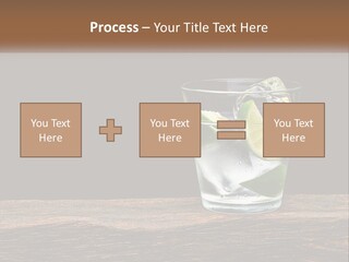 A Glass Of Water With Limes And Ice On A Wooden Table PowerPoint Template