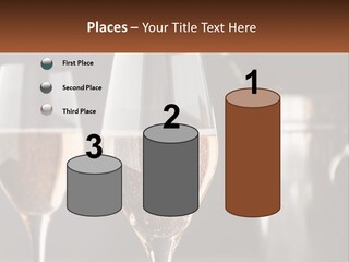 A Couple Of Wine Glasses Sitting On Top Of A Table PowerPoint Template