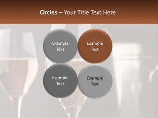 A Couple Of Wine Glasses Sitting On Top Of A Table PowerPoint Template