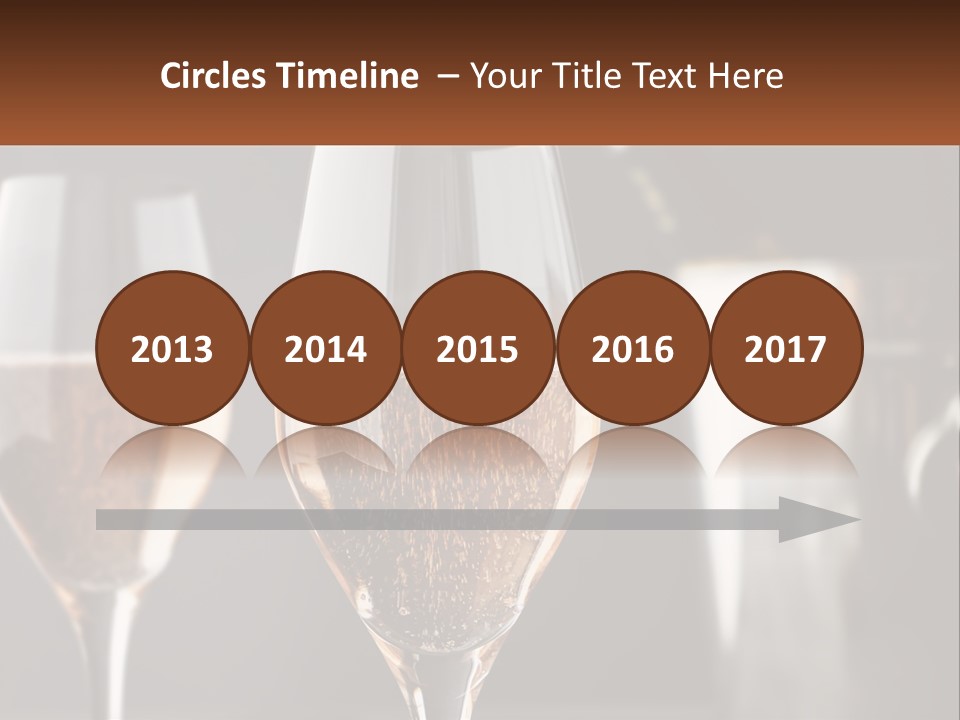 A Couple Of Wine Glasses Sitting On Top Of A Table PowerPoint Template