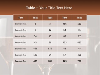 A Couple Of Wine Glasses Sitting On Top Of A Table PowerPoint Template