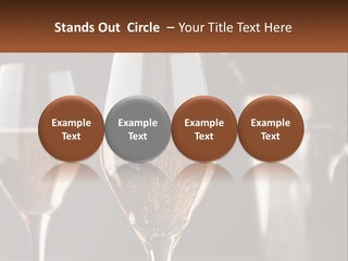 A Couple Of Wine Glasses Sitting On Top Of A Table PowerPoint Template