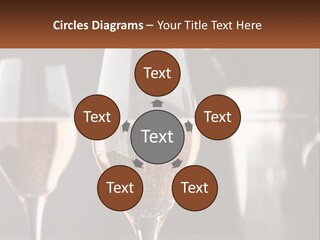 A Couple Of Wine Glasses Sitting On Top Of A Table PowerPoint Template