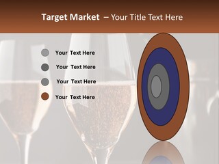 A Couple Of Wine Glasses Sitting On Top Of A Table PowerPoint Template