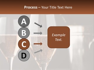 A Couple Of Wine Glasses Sitting On Top Of A Table PowerPoint Template