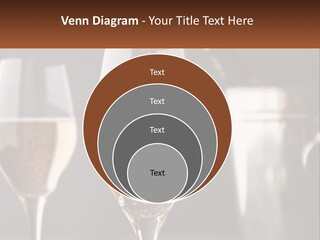 A Couple Of Wine Glasses Sitting On Top Of A Table PowerPoint Template