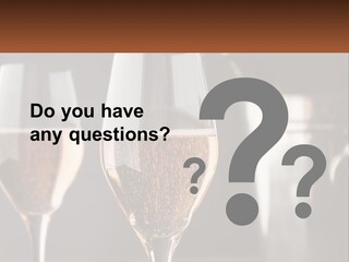 A Couple Of Wine Glasses Sitting On Top Of A Table PowerPoint Template