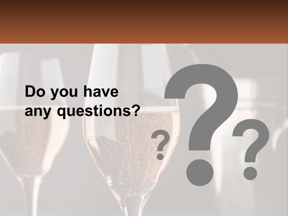 A Couple Of Wine Glasses Sitting On Top Of A Table PowerPoint Template