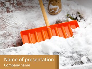 A Snow Shovel Is Laying In A Pile Of Snow PowerPoint Template