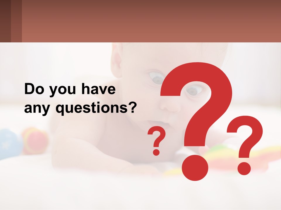 A Baby Laying On A Bed With A Toy PowerPoint Template