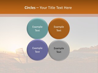A Bench Sitting On Top Of A Sandy Beach PowerPoint Template