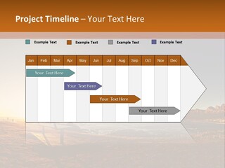 A Bench Sitting On Top Of A Sandy Beach PowerPoint Template